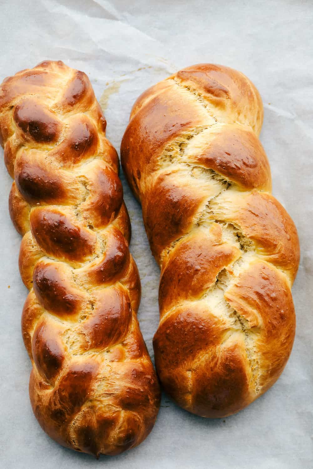 Challah Bread is a rich and fluffy loaf full of flavor. A Jewish traditional loaf, this incredible bread is going to be a favorite in your family baking! Baked six and three strand braided challah.