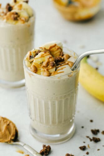 Peanut Butter Banana Smoothie is a rich refreshing drink that is good for you too! Full of protein, vitamins, and minerals use it as a workout recovery drink or a snack. Banana smoothie with straw