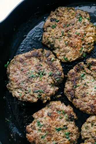 Homemade Breakfast Sausage is easier to make than you think and tastes way better than you can imagine! This is going to change the way you do breakfast. Homemade sausage sizzling in a pan.