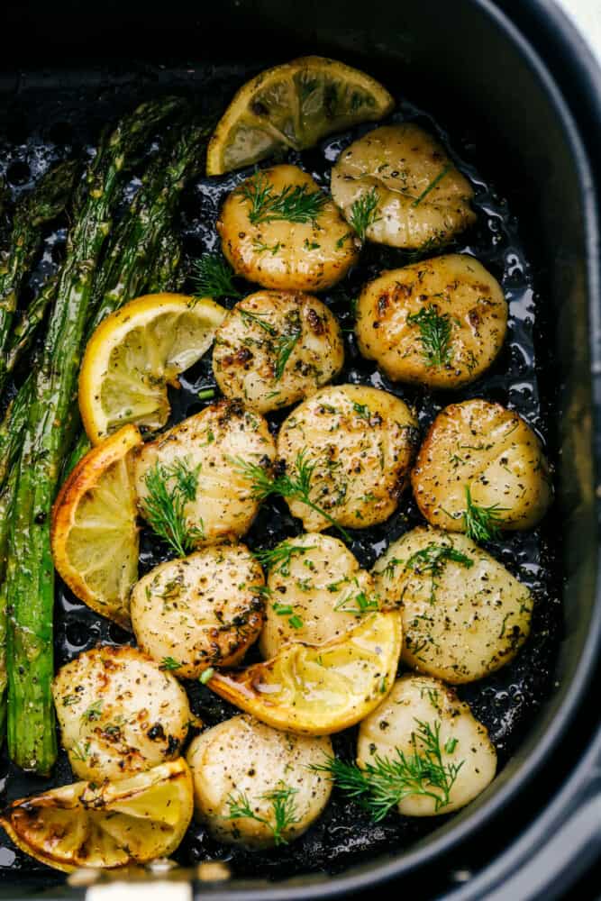 Air Fryer Lemon Dill Scallops are going to change the way you eat scallops! These are chock full of flavor, tender, juicy and succulent! Tender scallops cooked in an air fryer with lemon and dill.