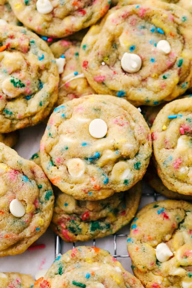Funfetti Cheesecake Pudding cookies are some of the best tasting and best looking cookies you'll ever have! Made with pudding mix, these are soft, chewy and oh so delicious! Mounds of funfetti cookies ready to eat.