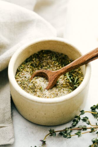 Italian Dressing Mix is super easy and way better than store bought! Full of flavor with ingredients you have right in the pantry. Italian dressing mix in a bowl with a tiny spoon.