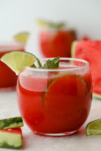 Watermelon Agua Fresca is the perfect drink to keep you cool this summer with the smooth, crisp flavor of fresh watermelon! You are going to love how crazy delicious and easy to make this is! Watermelon agua fresca in cup with mint and lime garnish