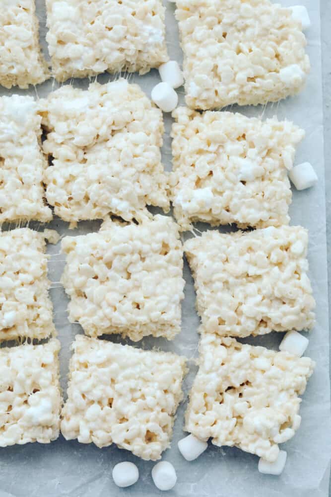 Everyone loves a good rice krispie treat. Sweet, soft, and extra ooey gooey, these Perfect Rice Krispie Treats will become your new favorite! Cut rice krispies on baking sheet