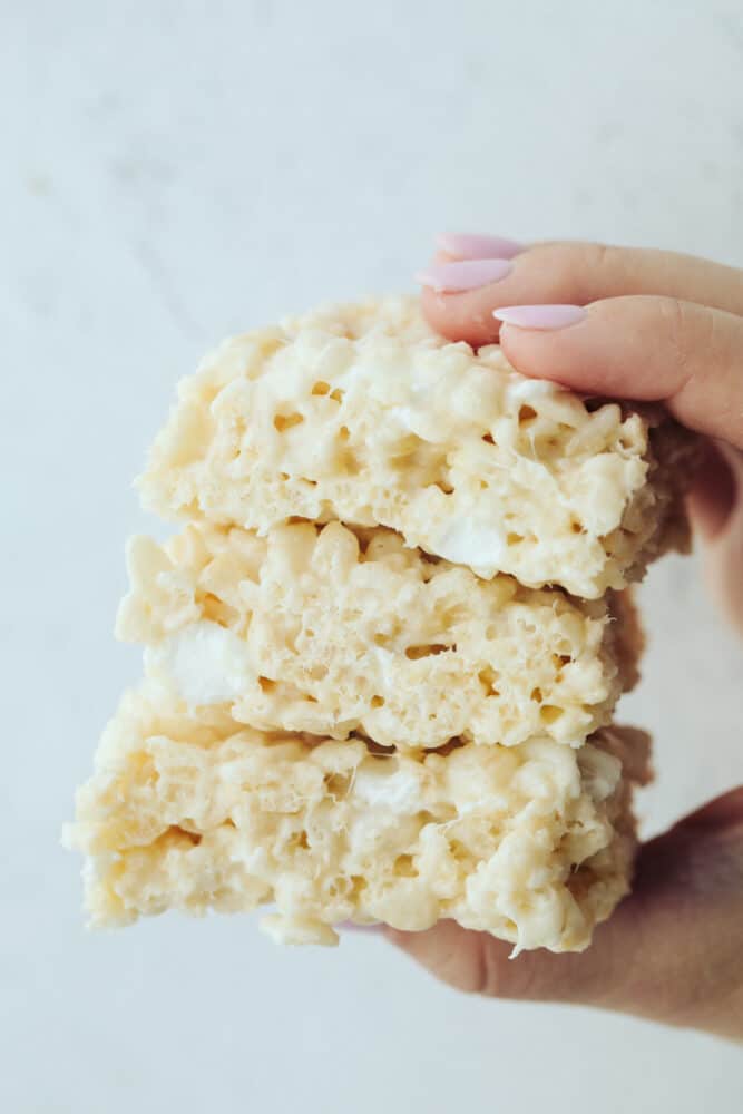 Everyone loves a good rice krispie treat. Sweet, soft, and extra ooey gooey, these Perfect Rice Krispie Treats will become your new favorite! 3 rice krispies in hand