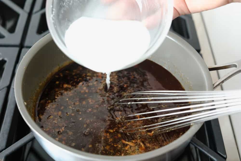 Homemade Teriyaki Sauce is super easy and way better than store-bought! Made with simple ingredients you can pronounce, this is going to become a staple in your family. Adding the cornstarch slurry to thicken the sauce.