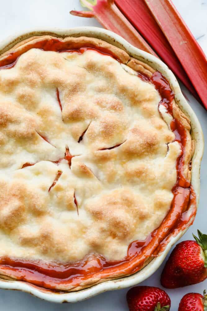 A sweet, tart fruit filling and golden, flaky crust make this Strawberry Rhubarb Pie the dessert of the summer. With a pie this fresh and decadent, you won't want store-bought again! Strawberry rhubarb pie
