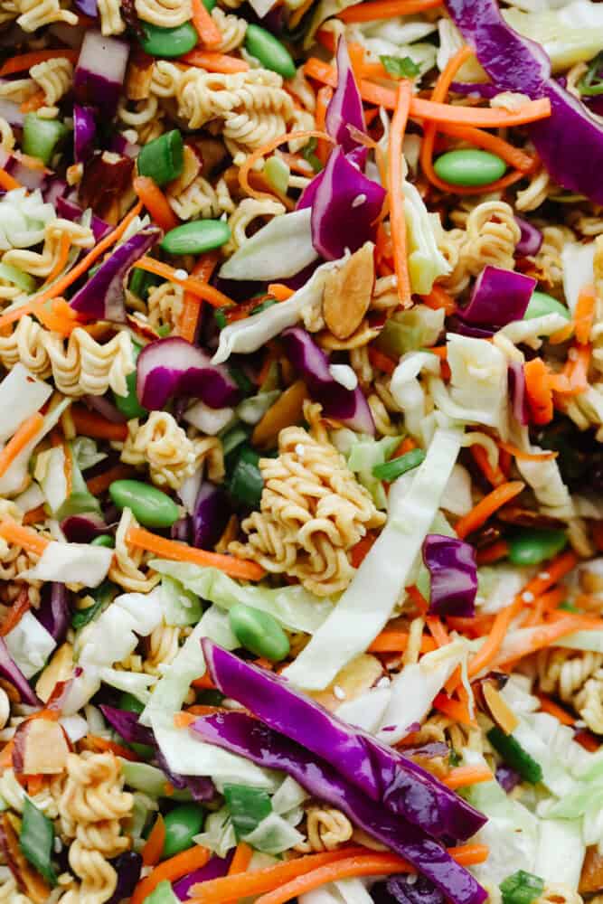 Asian Ramen Salad is full of color, flavor, and crunch! All of the fun textures make it perfectly satisfying and insanely delicious! Close up of the Asian Ramen Salad to show color and texture.