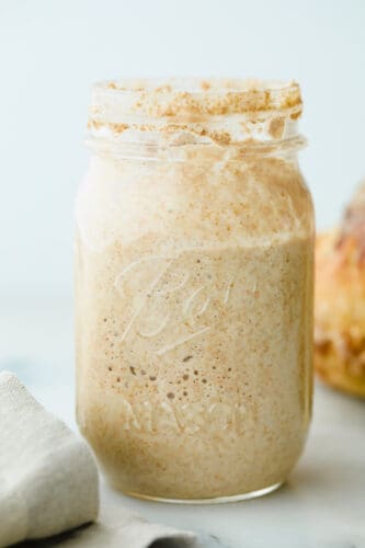 Start your sourdough journey with this guide on cultivating wild yeast! You only need flour, water, and a few minutes of maintenance each day to bake better bread! Sourdough starter in jar