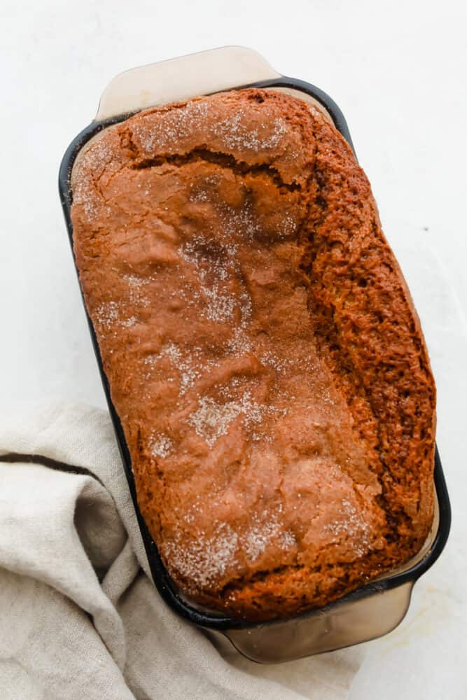 Amish Friendship Bread is the gift that keeps on giving! This simple starter yields sweet, delicious bread every time! A loaf of Amish Friendship Bread, sprinkled with cinnamon sugar.