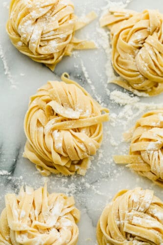 Homemade pasta is a labor of love but it is totally worth the extra work. This pasta is simple and easy, it just takes a bit of time Homemade pasta in nests ready to cook.