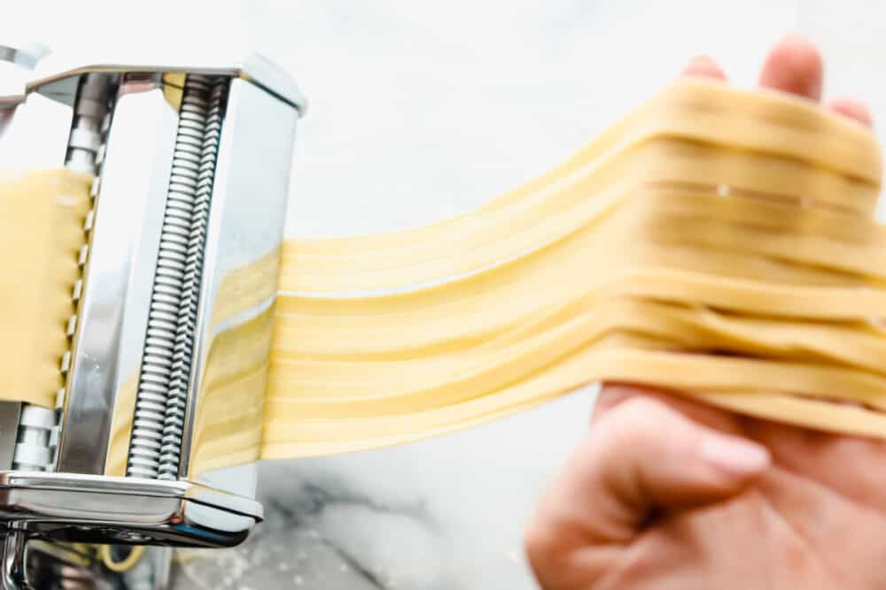 Homemade pasta is a labor of love but it is totally worth the extra work. This pasta is simple and easy, it just takes a bit of time Cutting the dough into long strands for cooking.