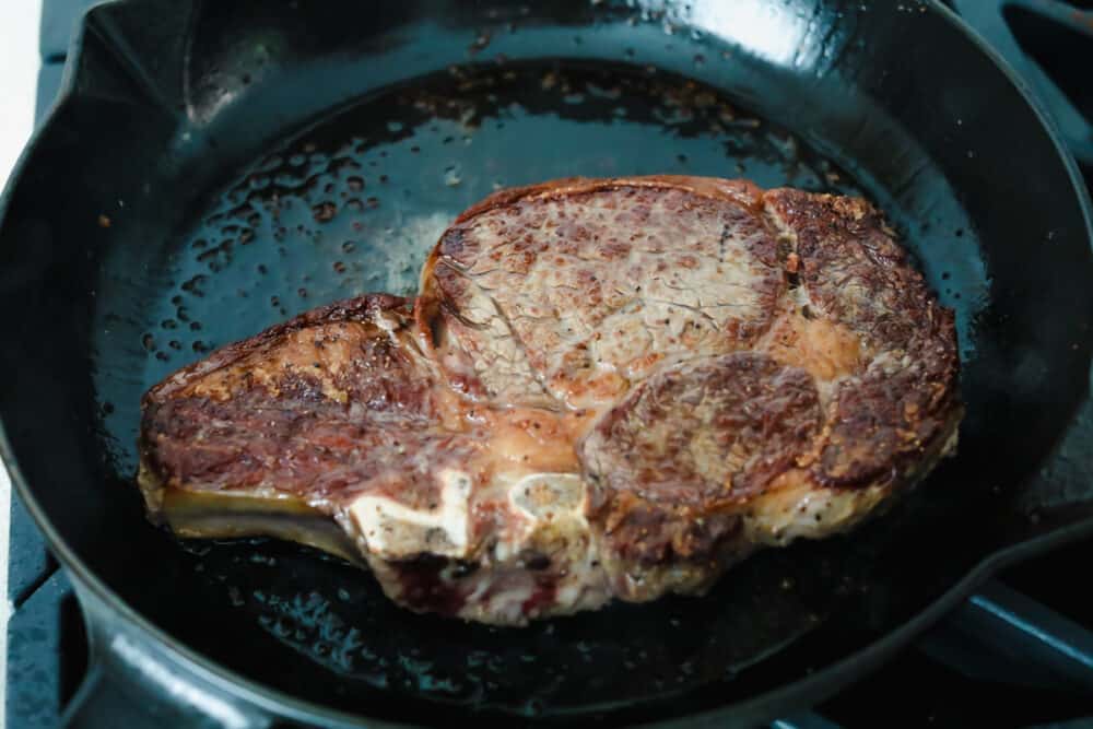 Achieving steakhouse-worthy flavors doesn’t have to be difficult! The ultimate ribeye steak is juicy, flavorful, and seared to perfection all in the comfort of your kitchen. Cooking ribeye steak in a skillet.
