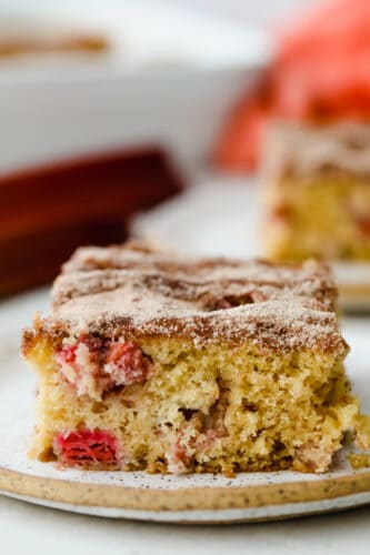 Cinnamon sugar rhubarb cake is a real crowd pleaser! The complementary ingredients of sweet and tart are incredible and are really going to knock your socks off! Rhubarb cake.