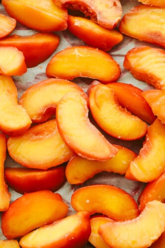 Freezing peaches is the best because they can be used in EVERYTHING! If you want to enjoy delicious peaches all year round then look no further because, with this recipe, you can have juicy, delicious peaches whenever you want! Frozen peaches ready to eat.