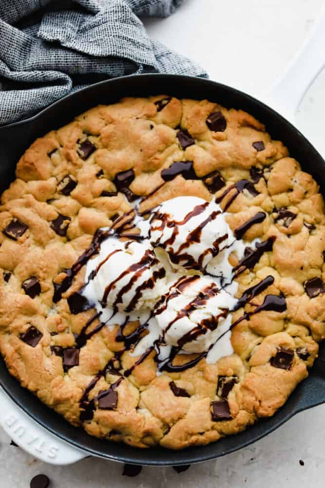 This ooey-gooey skillet cookie brings homemade cookies to the next level! It is warm, sweet and the chocolate just melts right in your mouth! You definitely won't be able to stop at just one bite! A skillet cookie.