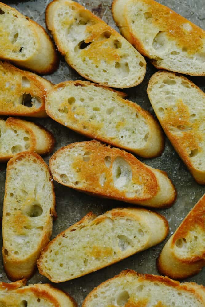 This easy, baked crostini is the best side to any Italian meal! They're golden, delicate pieces of heaven ready for your favorite toppings! Slices of crostini without any toppings.