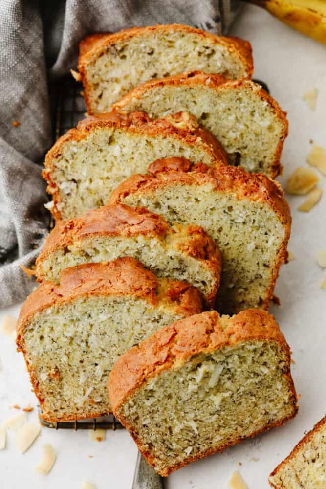 Coconut banana bread is sweet and insanely delicious! The moist texture combined with its amazing taste will make it hard to stop after just one slice! Sliced coconut banana bread.