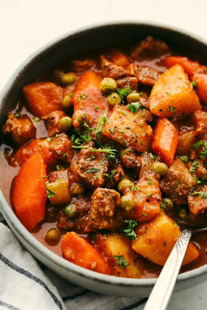 Instant Pot Beef Stew is perfect for those cool fall nights, and great when you want to whip up cozy beef stew in under an hour! Sauté the beef in the bottom of the instant pot, throw in your veggies and broth, turn it on and call it a day! A close upon instant pot beef stew.