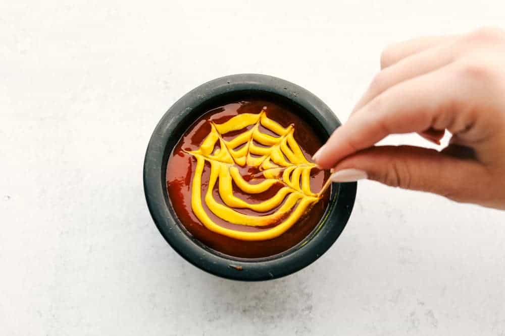 Nothing screams fun, quite like Mummy Hot Dogs for Halloween dinner. Serve these fun little vittles before trick or treating or at your next Halloween party. Spider web dip!