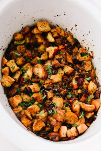 This classic sausage herb stuffing is full of an amazing mixture of flavors! The spices used in this are the star of the show and it will be a side dish that everyone goes crazy over! Stuffing in a serving dish.