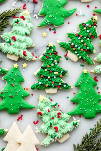 If you're wanting a dessert that is both festive and delicious, look no further! These Christmas tree sugar cookies will shine at any holiday party! A variety of Christmas tree cookies.
