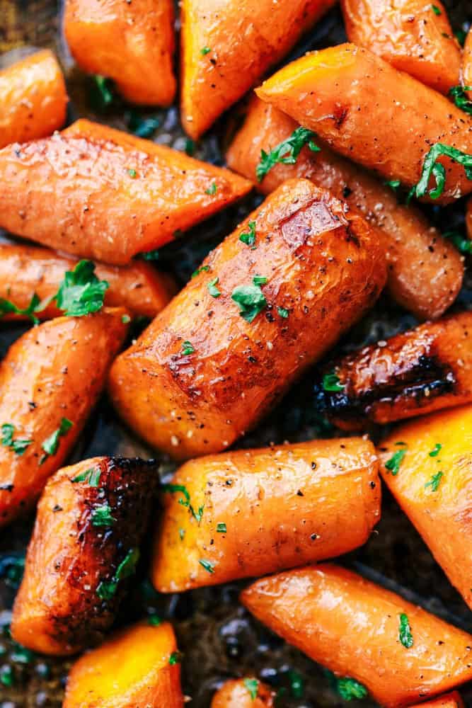 Roasted Brown Butter Honey Garlic Carrots make an excellent side dish. Roasted to tender perfection in the most incredible brown butter honey garlic sauce these will become a new favorite! Roasted Brown Butter Honey Garlic Carrots close up.