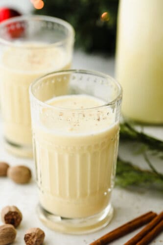 Nonalcoholic eggnog is incredibly easy to make and such a delight for the entire family for the holiday season. If you have milk, cream, sugar, and eggs, you can have this eggnog ready in 20 minutes! A glass of nonalcoholic eggnog.