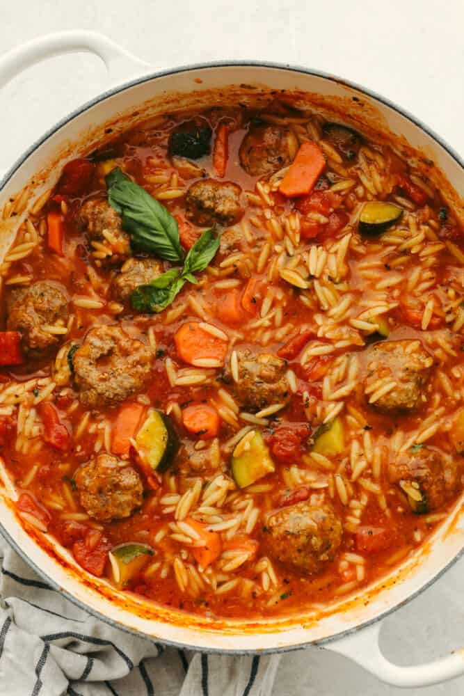 This meatball soup is hearty and full of amazing flavor. This only takes about 30 minutes to cook up and can be made with homemade or frozen meatballs! It's a MUST TRY recipe for sure! A pot of meatball soup.