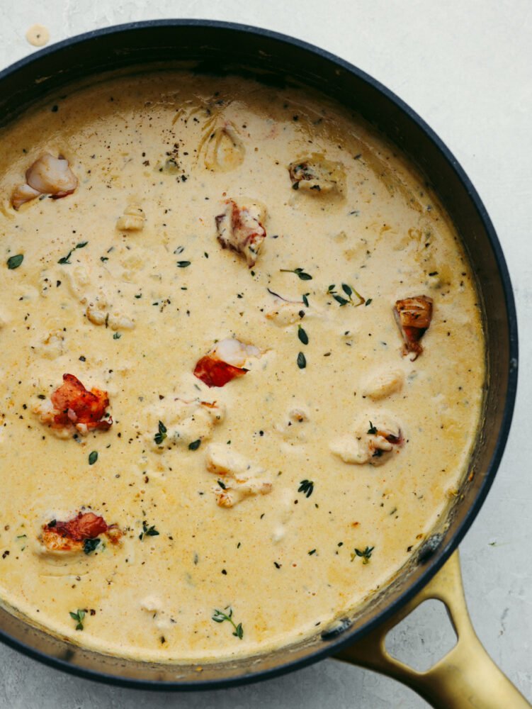 Lobster ravioli sauce is rich and creamy, full of fresh herbs and garlic! It's bursting with flavor and the perfect addition to all of your favorite pasta dishes. Lobster ravioli sauce in a saucepan.
