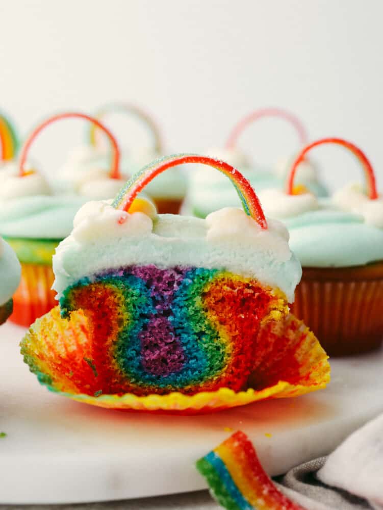 No need for a pot of gold when you’ve got these cupcakes around! These colorful rainbow cupcakes are perfectly moist, topped with the most amazing buttercream. They’ll light up any party! A rainbow cupcake cut in half.