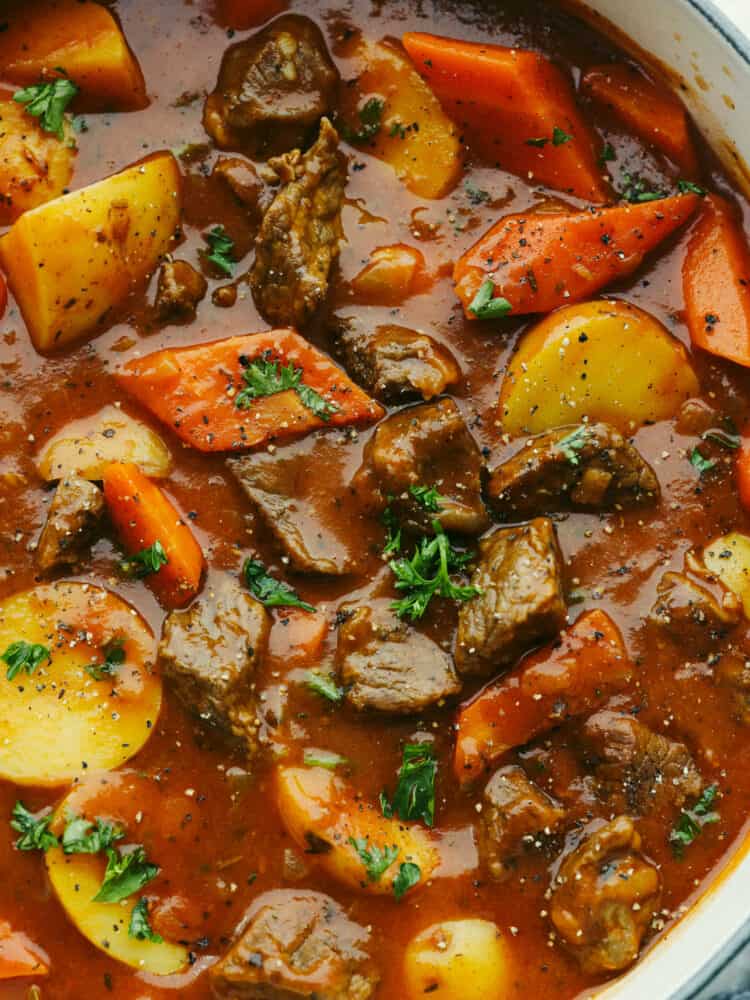 Your family is going to love this hearty Guinness beef stew! This traditional Irish meal is filled with rich, meaty flavor, tender vegetables, and melt-in-your-mouth beef! Closeup of Guinness beef stew.