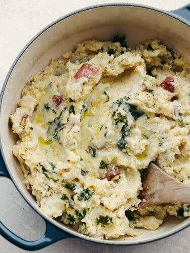 Creamy, buttery, and full of flavor, these Colcannon potatoes will become your new go-to side dish recipe for any meal! They are simple and easy to make and packed with all kinds of delicious ingredients! The top view of a pot filled with colcannon potatoes ready to serve.