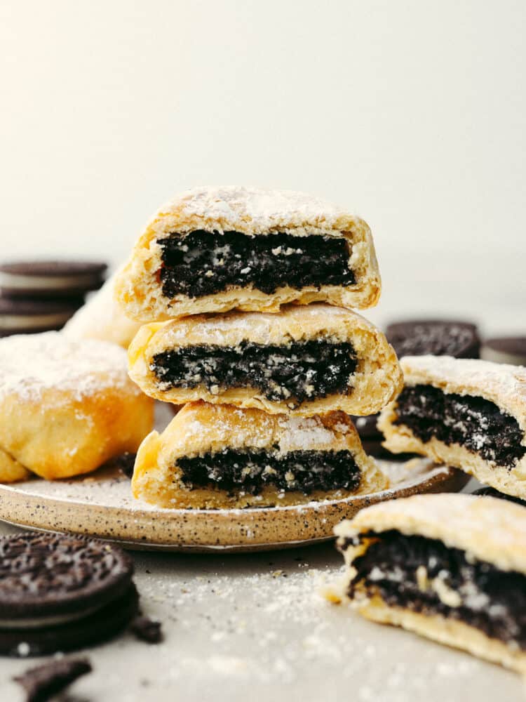 Get all the deliciousness of deep-fried Oreos without the mess or calories in this quick and easy air fryer Oreos recipe! It only takes 3 ingredients to make them and they’ll have the whole family hooked! 3 air fryer Oreos stacked on top of each other.
