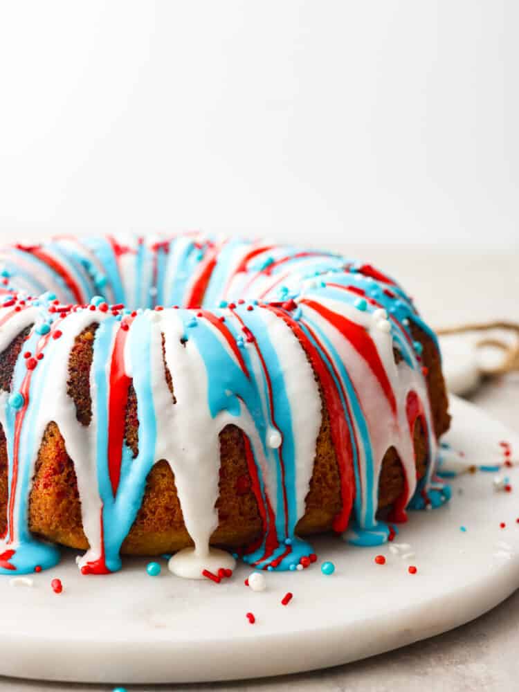 This firework bundt cake is exploding with colors and flavor! It not only looks impressive but it tastes so delicious that you will definitely be making this for every Fourth of July! The side view of a firework bundt cake.